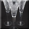G03. Set of 4 miscellaneous Waterford Crystal Millenium toasting flutes - $100